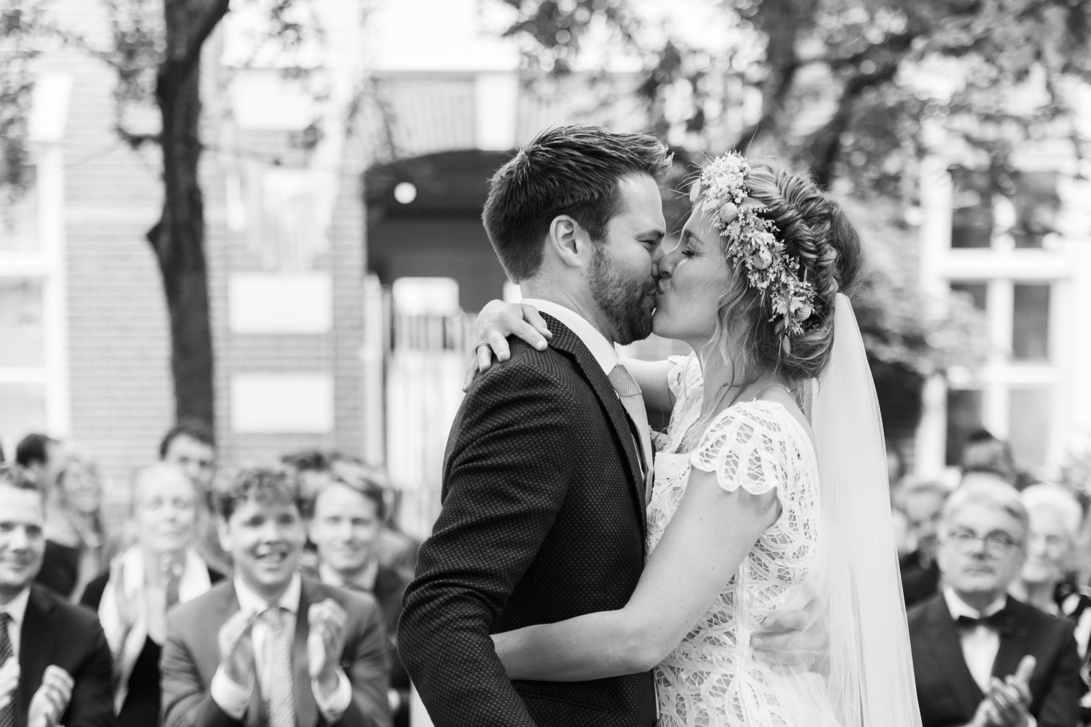 Bride and groom kissing their first kiss in Amsterdam